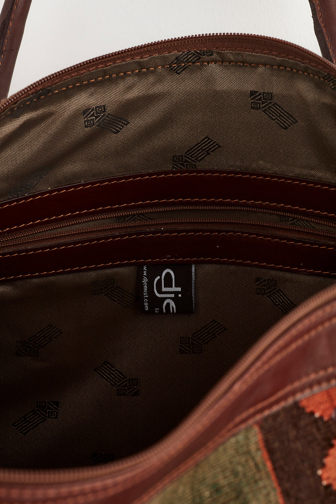 Red and brown large kilim and leather weekend bag inside detail