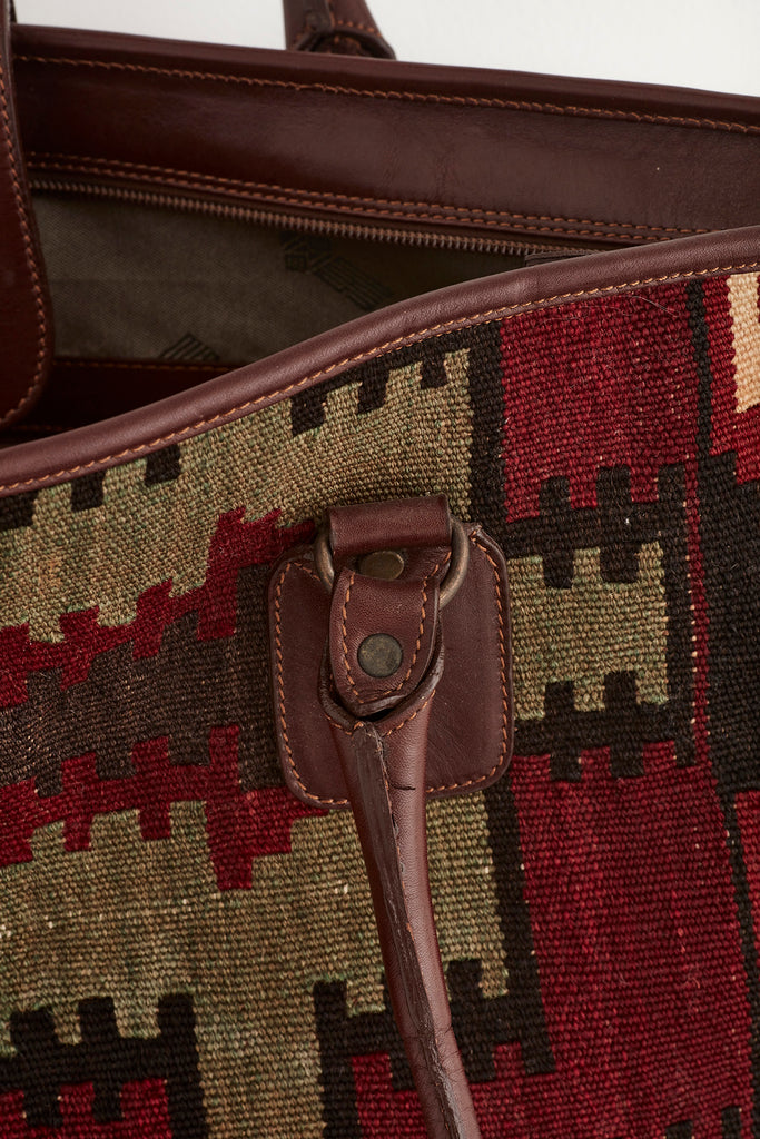 Multi coloured large kilim and leather handbag handle detail