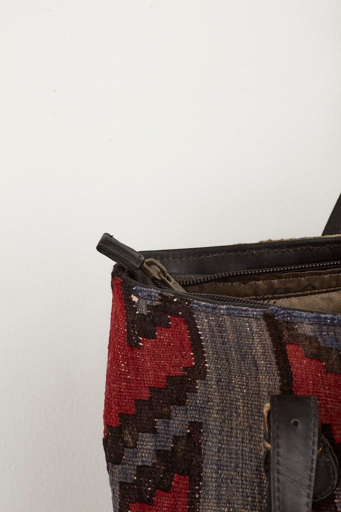 Red and brown medium kilim and leather handbag zipper detail