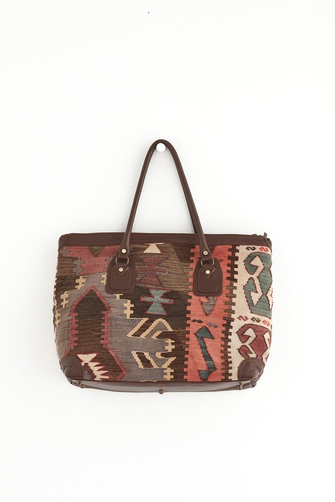 Multi coloured large kilim and leather weekend bag front
