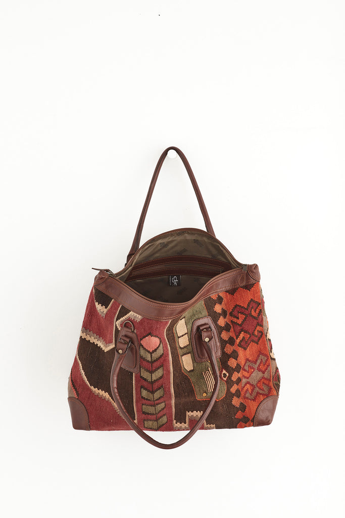 Red and brown large kilim and leather weekend bag open