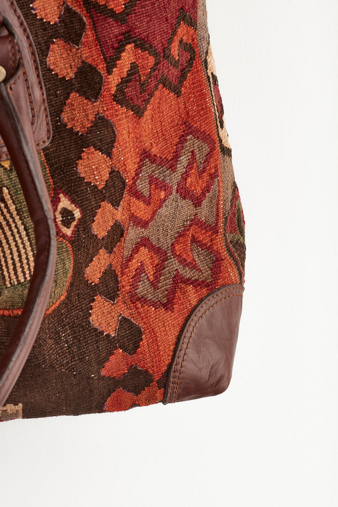 Red and brown large kilim and leather weekend bag colour detail