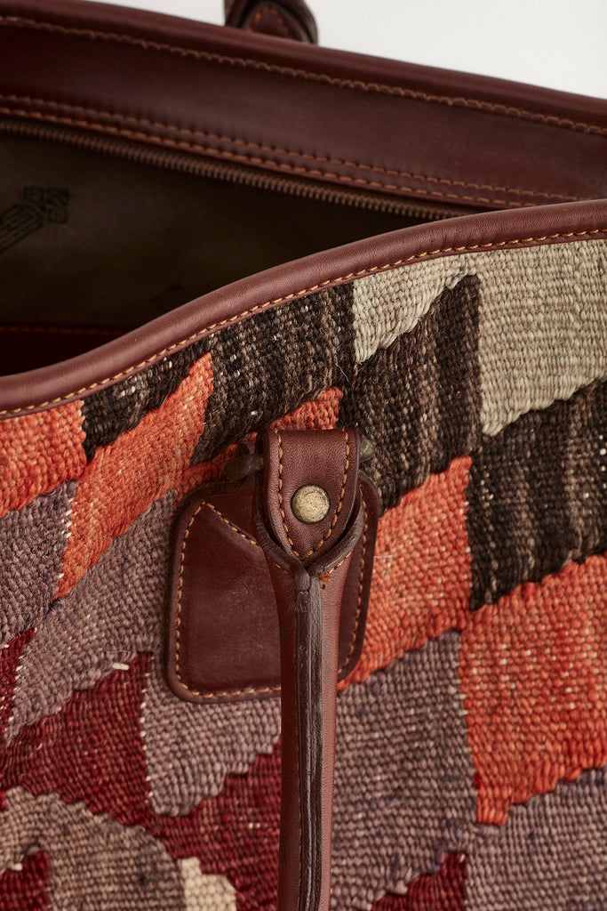Multi coloured large kilim and leather handbag handle detail