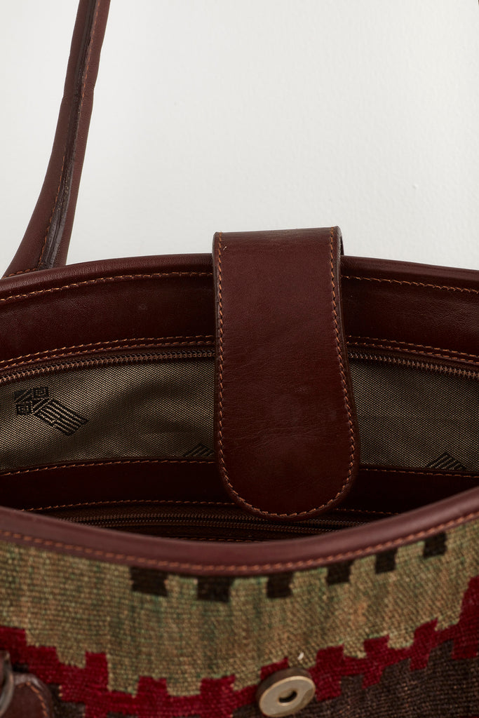 Multi coloured large kilim and leather handbag opening detail