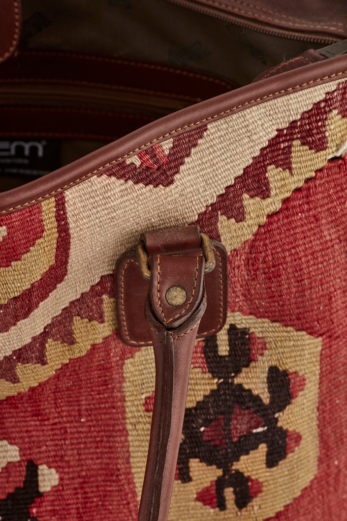 Red and browb large kilim and leather handbag stitching detail