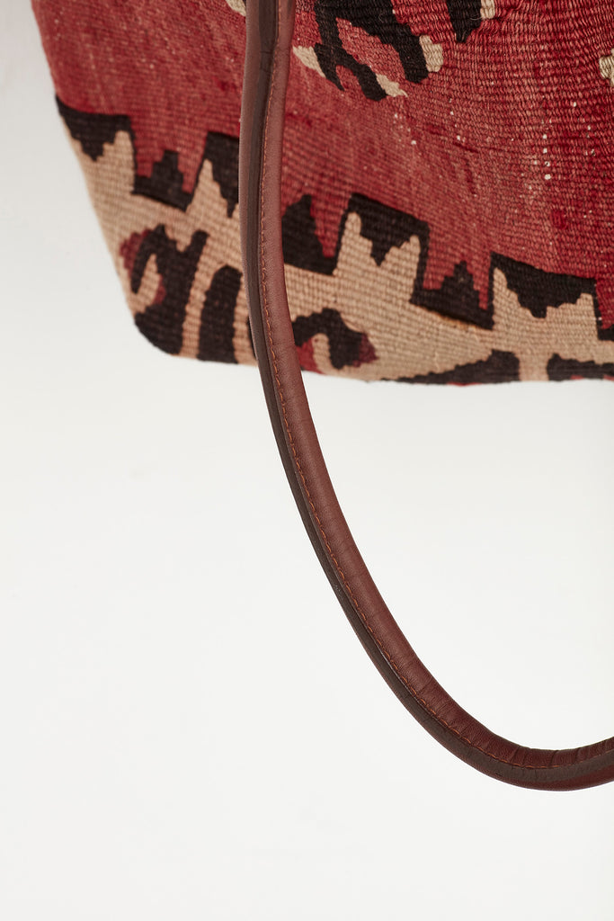 Red and browb large kilim and leather handbag handle detail