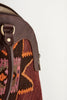 Multi coloured large kilim and leather handbag material detail