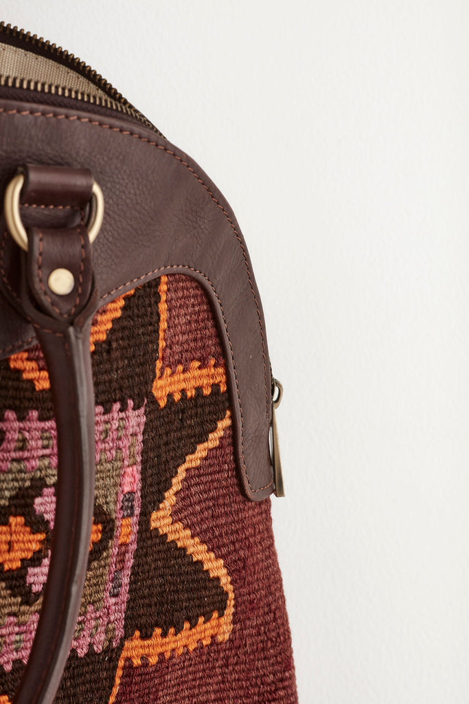 Multi coloured large kilim and leather handbag material detail