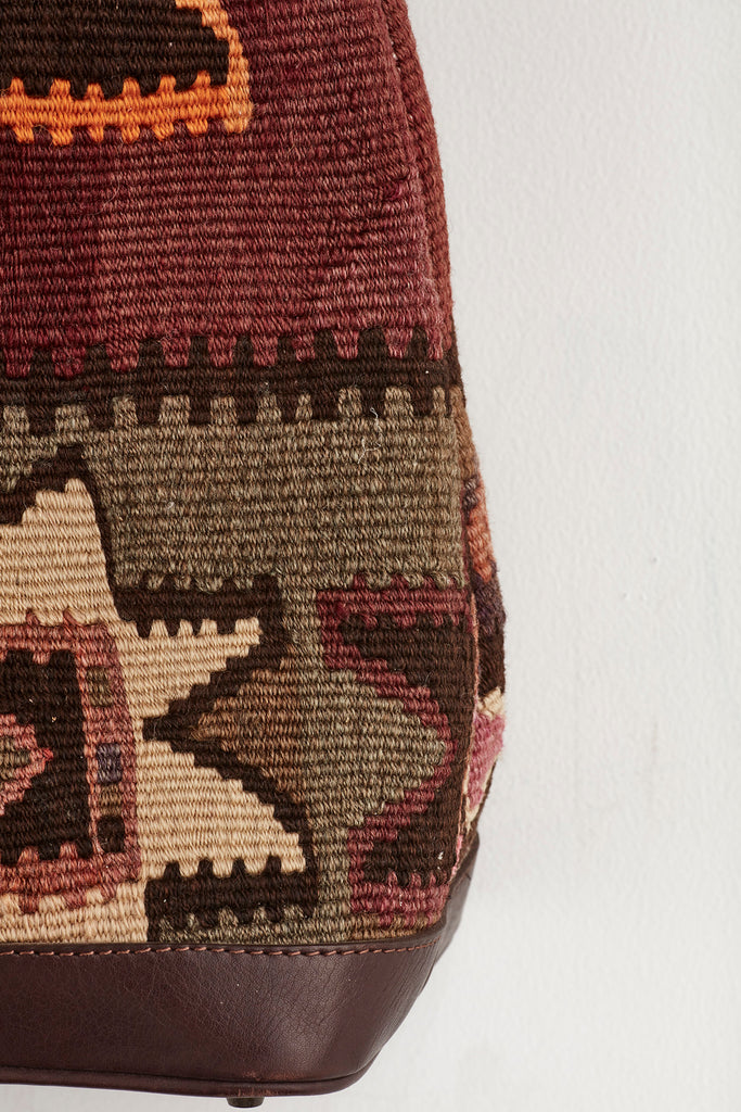 Multi coloured large kilim and leather handbag pattern detail
