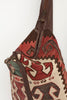 Multi coloured kilim and leather convertible backpack handbag top opening detail